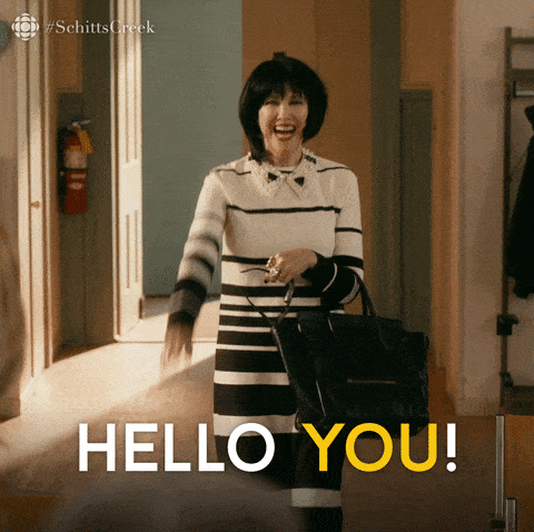 Moira Rose welcoming someone in