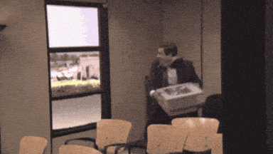 Office worker carrying a big box