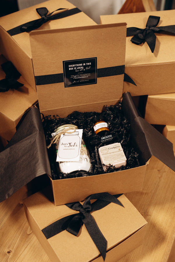 Black gift box packed with Canadian small-business products