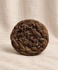 double chocolate chip cookie on fabric background